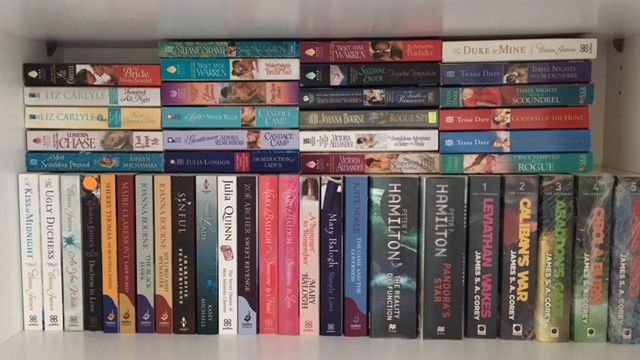 Just one shelf of my five-shelf book collection. Yes, I love my romance novels! ;)